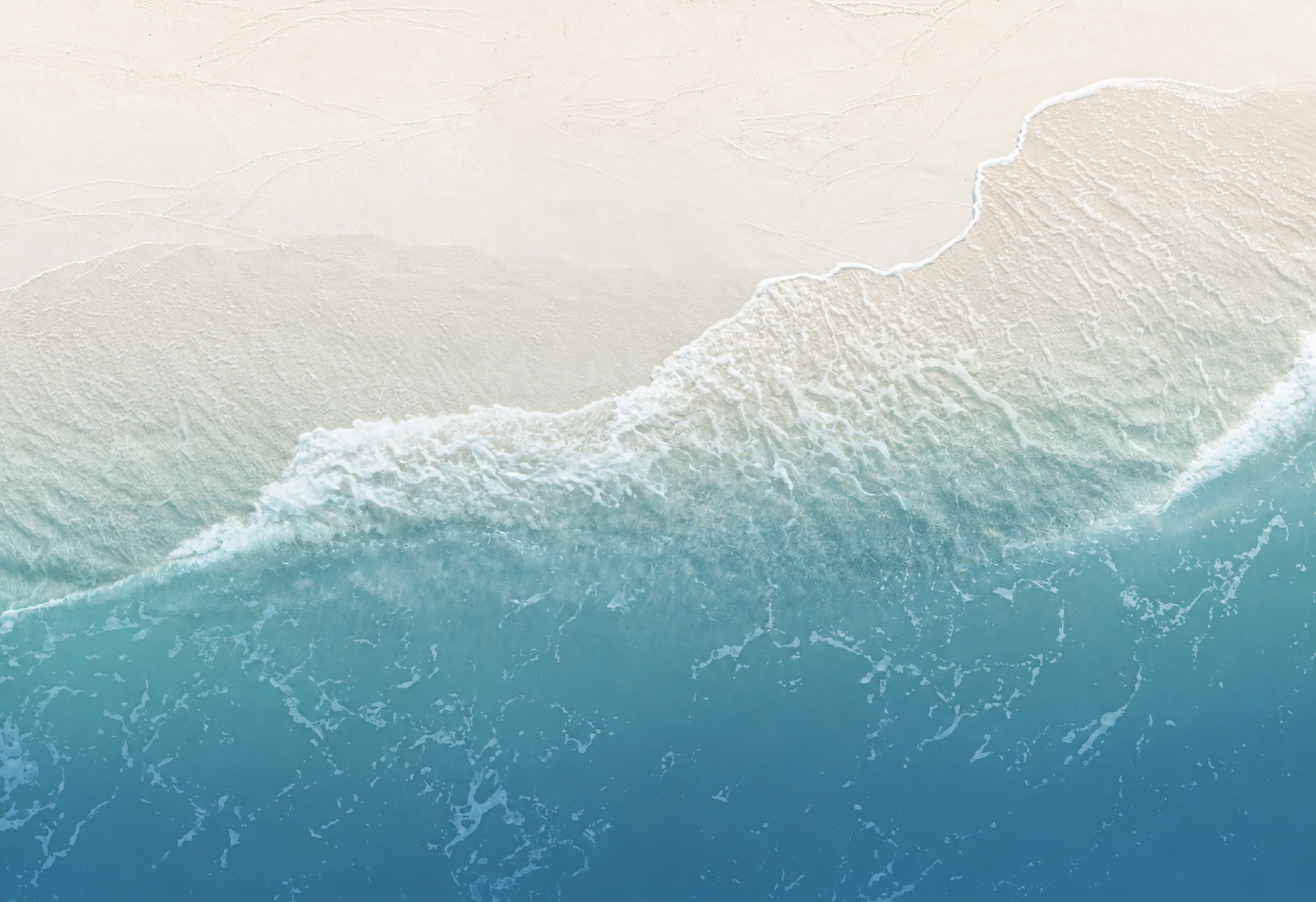 Atlantic Ocean waves meeting a pale shoreline
